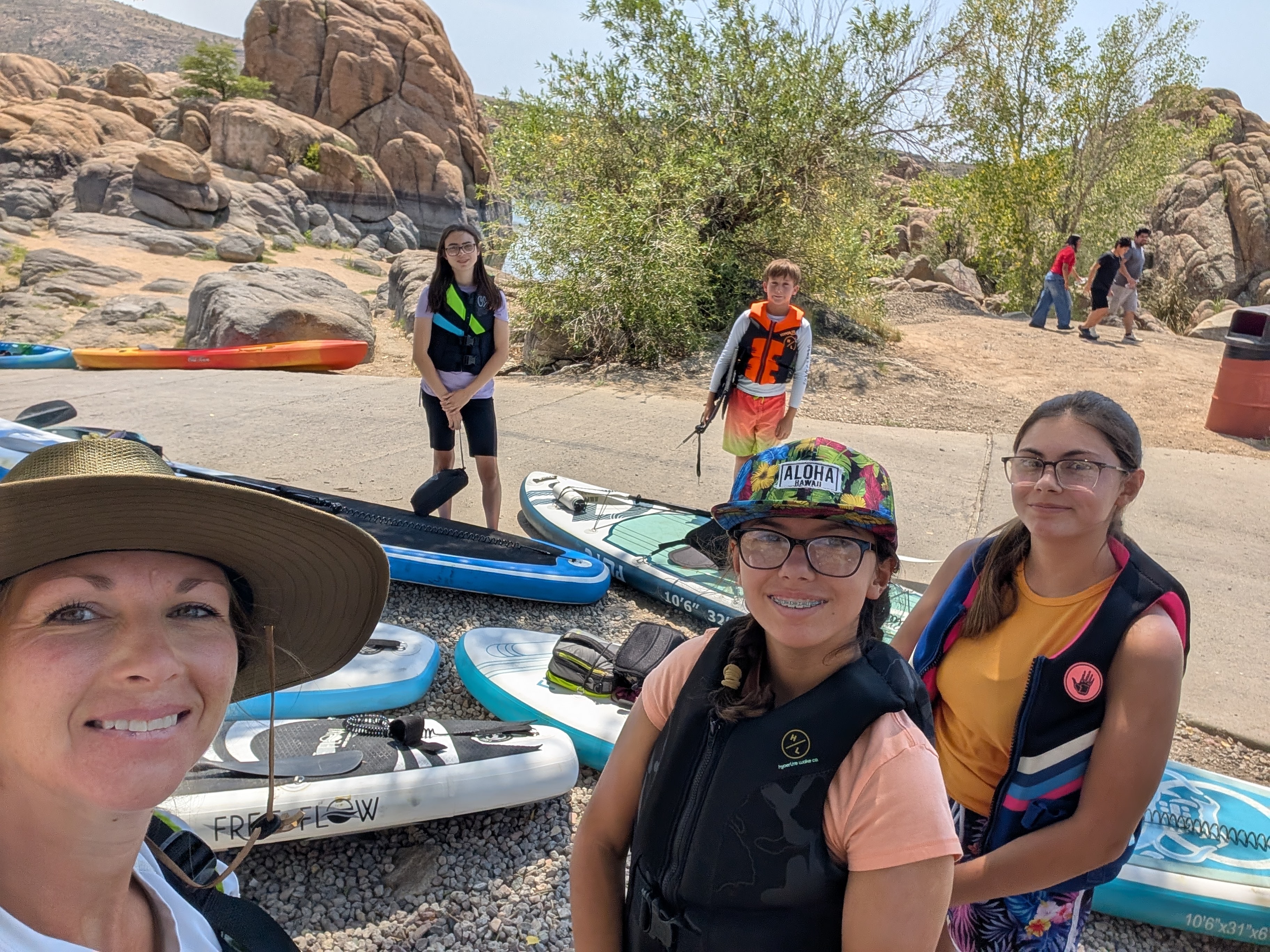 Family with paddleboards at Watson Lake