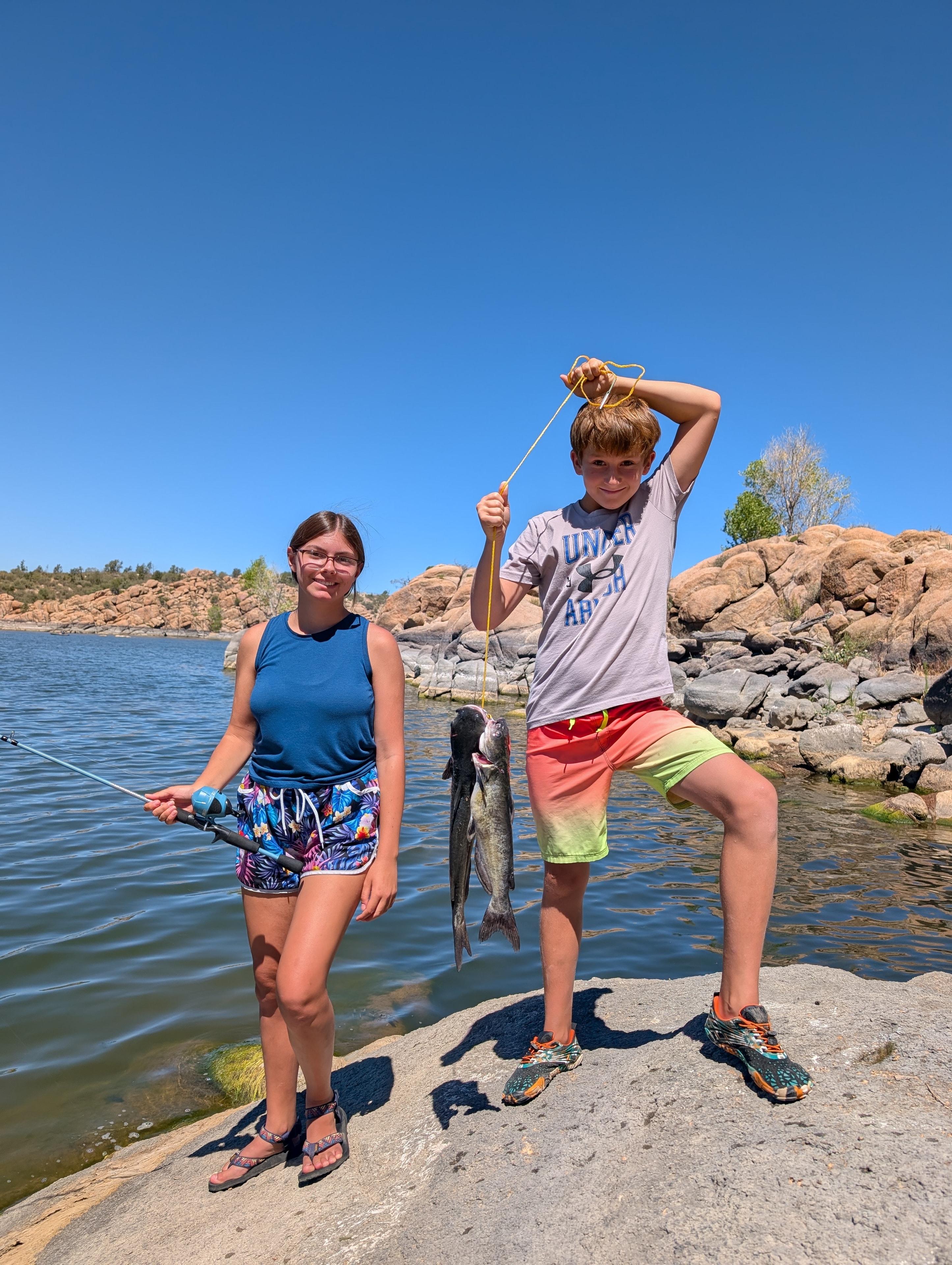 Kids holding their catfish catch at Watson Lake