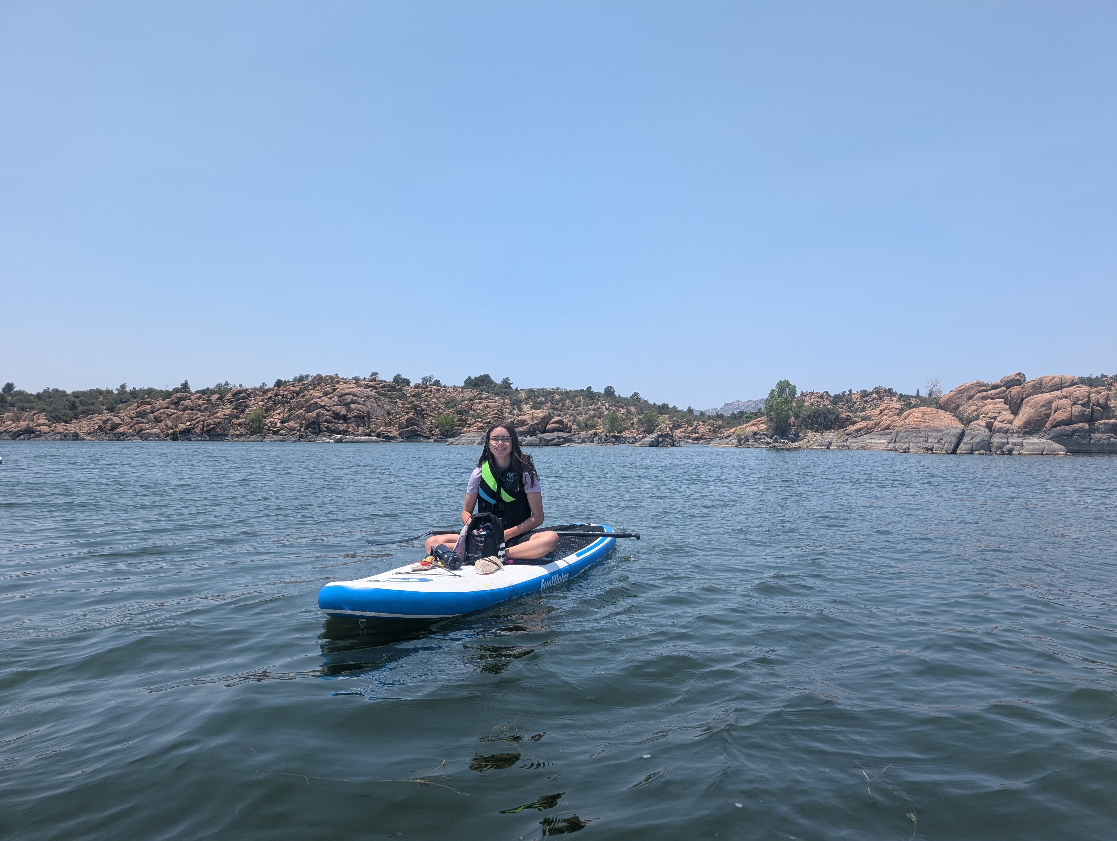 Kid on a paddleboard at Watson Lake