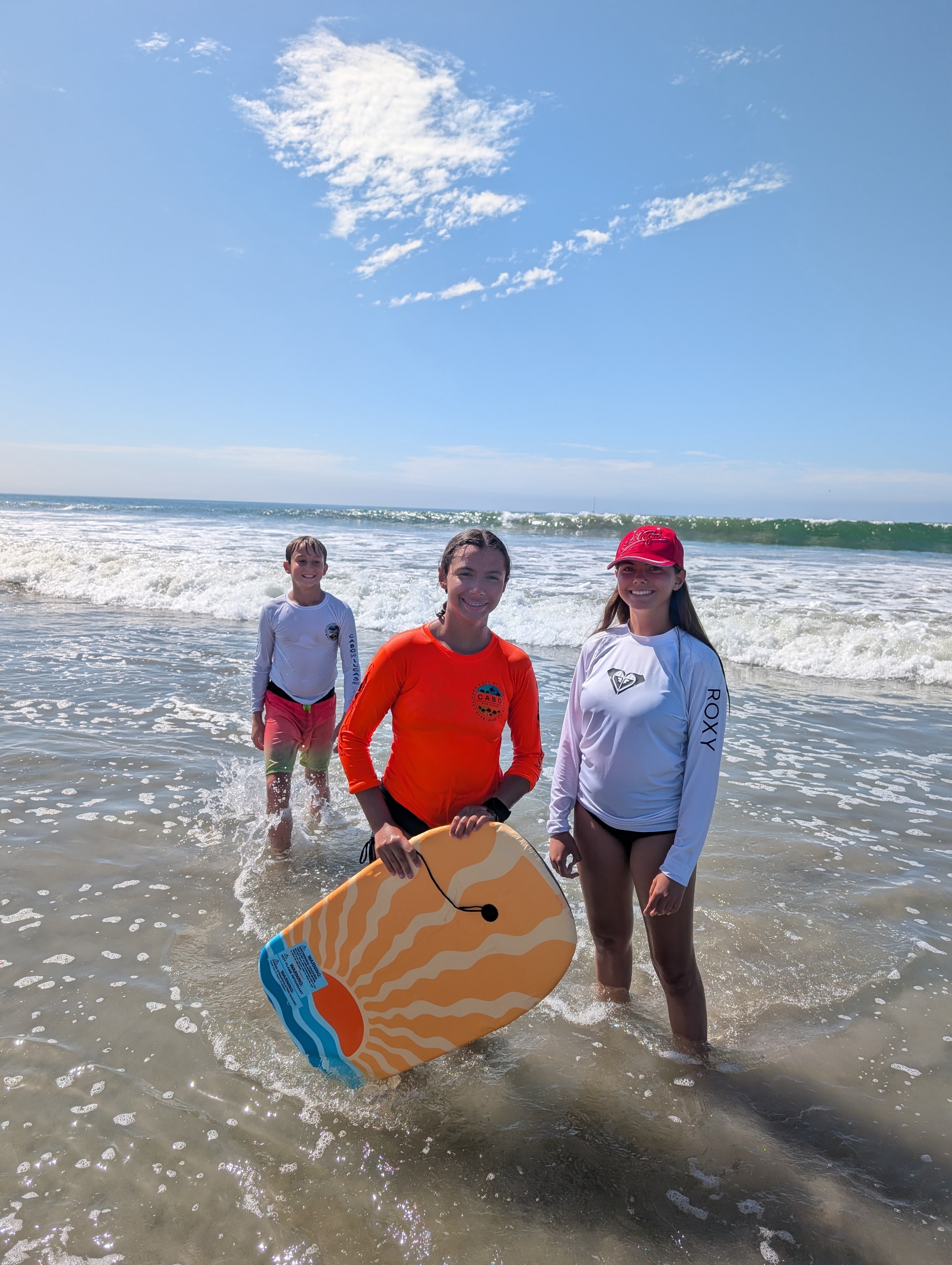 Kids running through a wildflower meadow